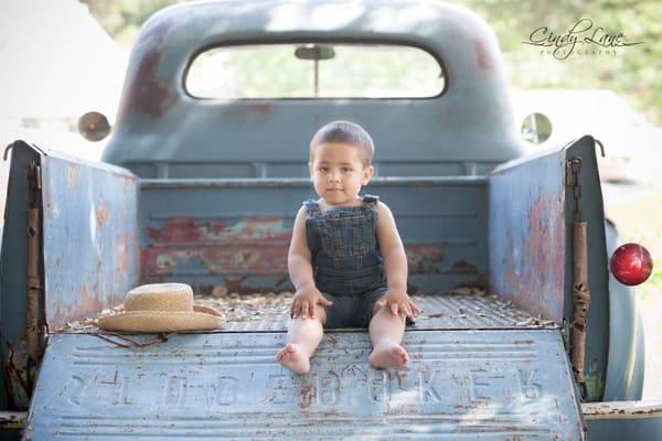 My grandson in one of Cindy's awesome props, a real running Studebaker!! Love her grounds there are endless photo opps!!!