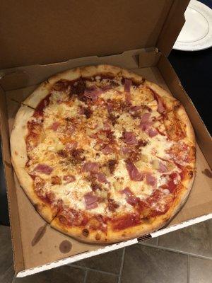 Hawaiian pizza with bacon and ham