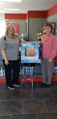 Grand Opening winner at Widdon's Air & Electrical in Houston was Joyce Dunigan of Houston, presenting Joyce with her new Compact Refrigerato