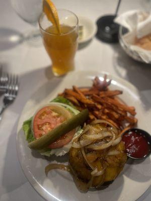 Cheddar cheese with sautéed onions sweet potato fries and Blue Moon beer( Rosie O'grady's Burger)