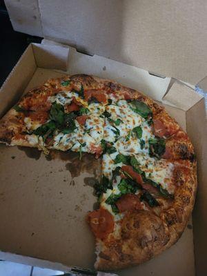 Spinach and pepperoni pizza