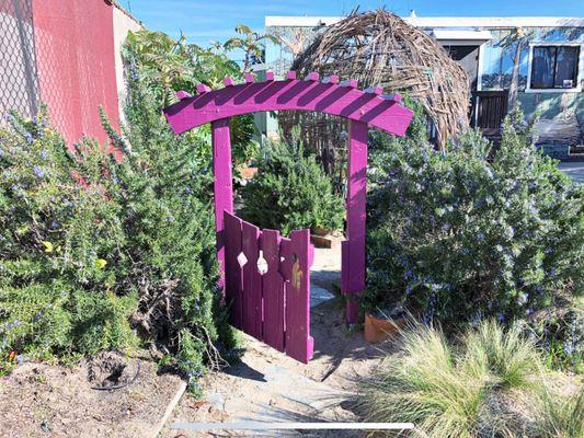 A garden with Playmates' signature gate.