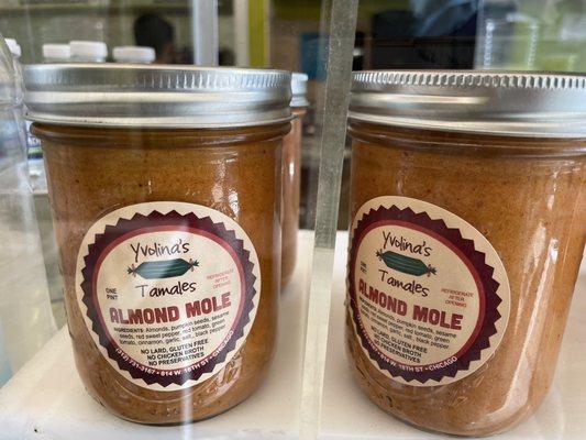 Jars of mole for sale at the counter. This one is almond mole.