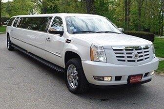 12-14 passenger white Cadillac Escalade is perfect for weddings, nights out on the town and proms. Book online at www.tuxedoblack.com