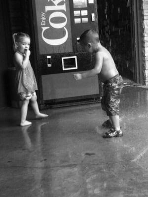 Playing outside the hotel waiting for the rain to clear up