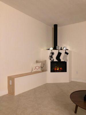 Custom designed fireplace with exposed chimney & side bench