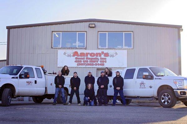 Team in front of shop