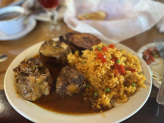 Ox tail with yellow rice. You get 3 pieces of oxtail.