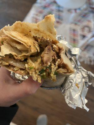 Giant chunk of meat in my vegetarian burrito.