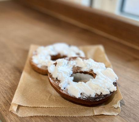 Fresh baked bagel with vegan cream cheese