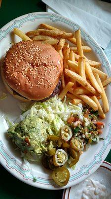 Hamburger with roasted chile peppers and jalepenos, fries, and guacamole.