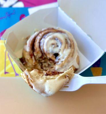 Warm cinnamon roll with icing