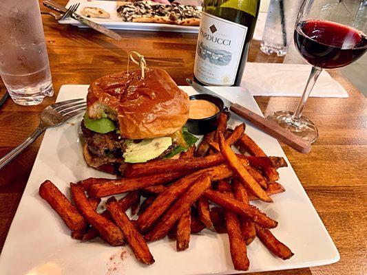 Burger with added avocado - enormous and delicious! Sweet potato fries did not cost extra! Chipotle sauce is super yummy.