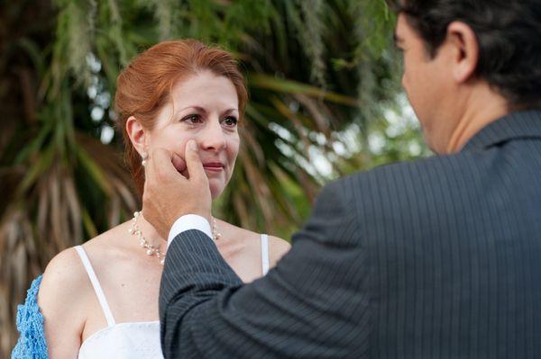 Bride with tear during elopement in City Park by The Red M Studio