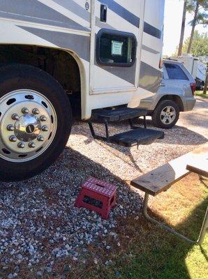 Site #60-had to step on stool to step up to seat of picnic table to reach BOTTOM step of our RV. Front wheels were 10" off the ground. #FAIL