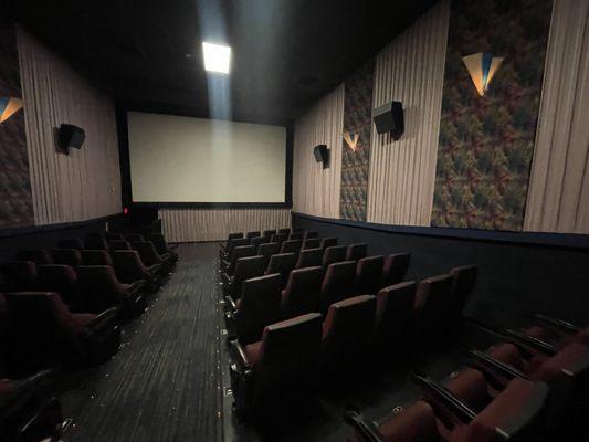 Theater 4 with rocker chairs.  Standard screen size and speaker placement.