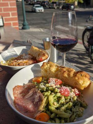 The most amazing pesto pasta I've ever had in my life, and the pasta bolognese in the back.