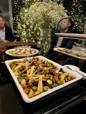 Roasted veggies, mini crab cakes, smashed potatoes with crème fraiche, and steak skewers with chimmichurri