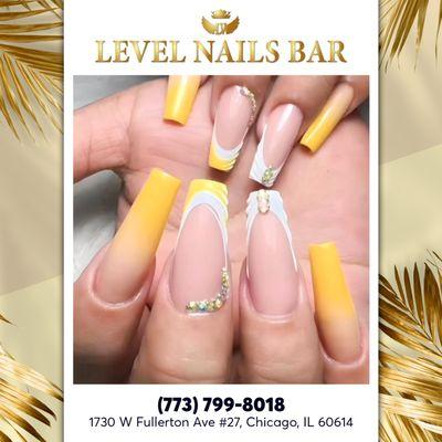 Brighten up with a fresh twist on classic French tips in yellow and white.