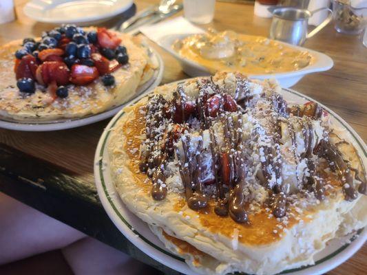 Nutella pancakes with coconut and strawberry.