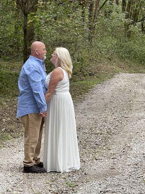 A very happy bride & groom start the walk the path of life at Butterfly Hollow