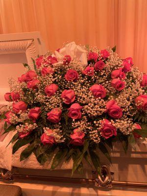 Spray of flowers over the casket.