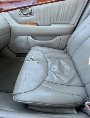 Ripped leather on seat cushion