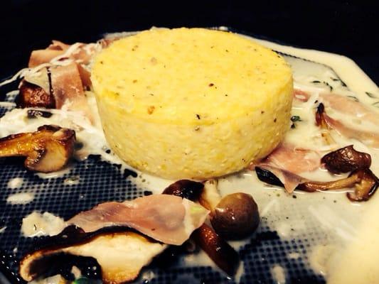 The infamous stone ground baked grits with country ham, mushrooms, fresh thyme and Parmesan