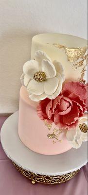 The details were amazing. Wrapped in buttercream. Flowers were fondant and they held up nicely..