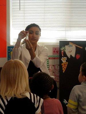 Teaching kids how to brush their teeth. Preschool event