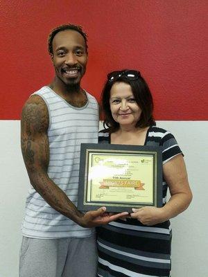 Receiving a certificate from a representative of San Bernardino county.