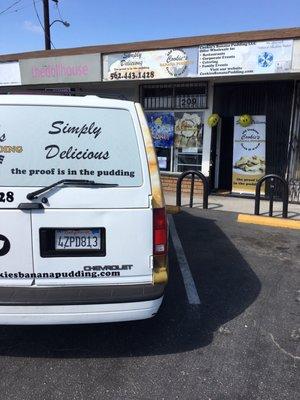 The delivery van in front of the store