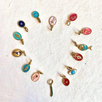 The best souvenir is jewelry Gigi Clozeau charms are are solid 18kt gold with resin color, handmade in France.