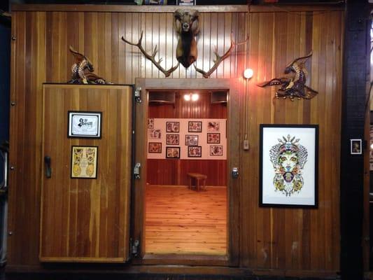 Very cool! Old wooden walking freezer converted in to tattoo art gallery.