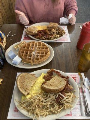 2 eggs, home fries and hash browns, meat, and toast. Pecan waffle