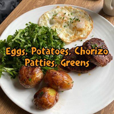 Two Friday eggs, potatoes, homemade chorizo patties and greens it was truly incredible!