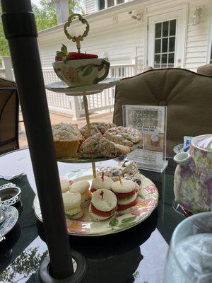 Sandwiches scones lemon cake and fresh strawberries