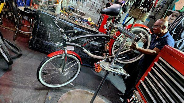 Bike technician Newt, working on a nice sport-cruiser.