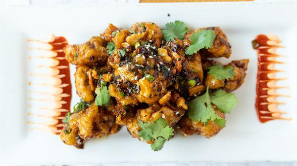 CRACKLIN' SPICY CAULIFLOWER** Fried sesame tempura battered cauliflower tossed in a Spicy Black Bean sauce. Yummmm!