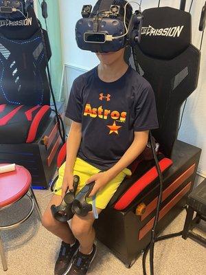 My son checking out the VR headset.