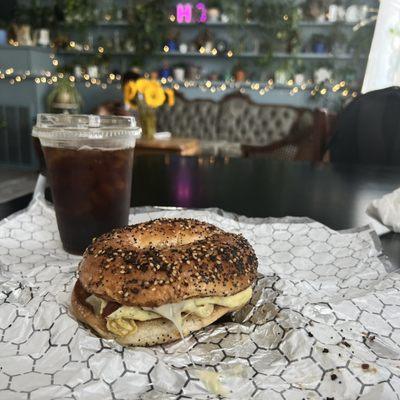 Bacon egg and cheese, and a cold brew.