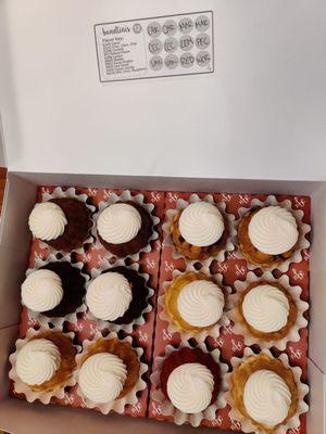 A dozen bundtinis with flavor sticker.