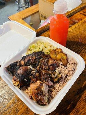 Large jerk chicken plate w/ rice & peas and cabbage--the plantains were a bonus.  And the best rum punch EVER!!