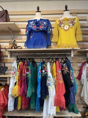 Floral embroidered blouses in a rainbow of colors and styles.