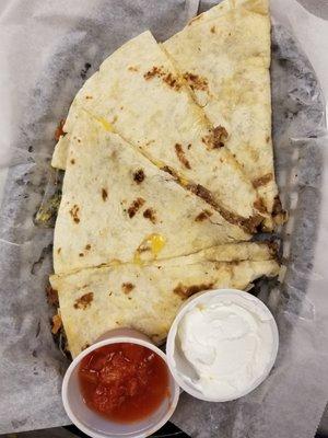 Steak quesadilla with salsa and sour cream