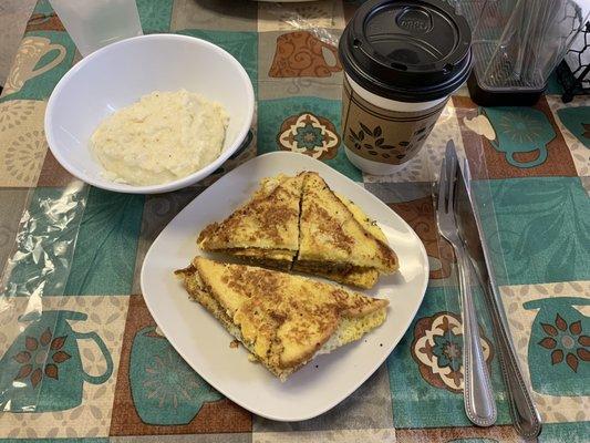 TikTok Sammie with sausage and cheese. Creamy grits.