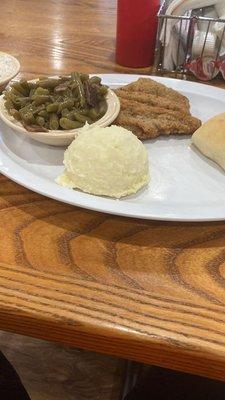 Dry mashed potatoes and unidentifiable chicken fried steak