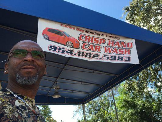 Crisp Hand Car Wash owner, VAL, outside his detailing business in Hollywood, FL.