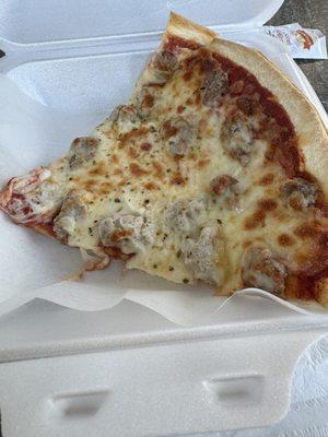 Slice of sausage pizza.