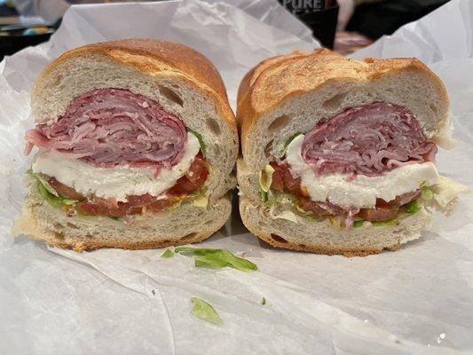 Ham, hard salami, fresh mozzarella, lettuce, tomatoes, salt, pepper and oregano. Excellent! HUGE sub for only $8!